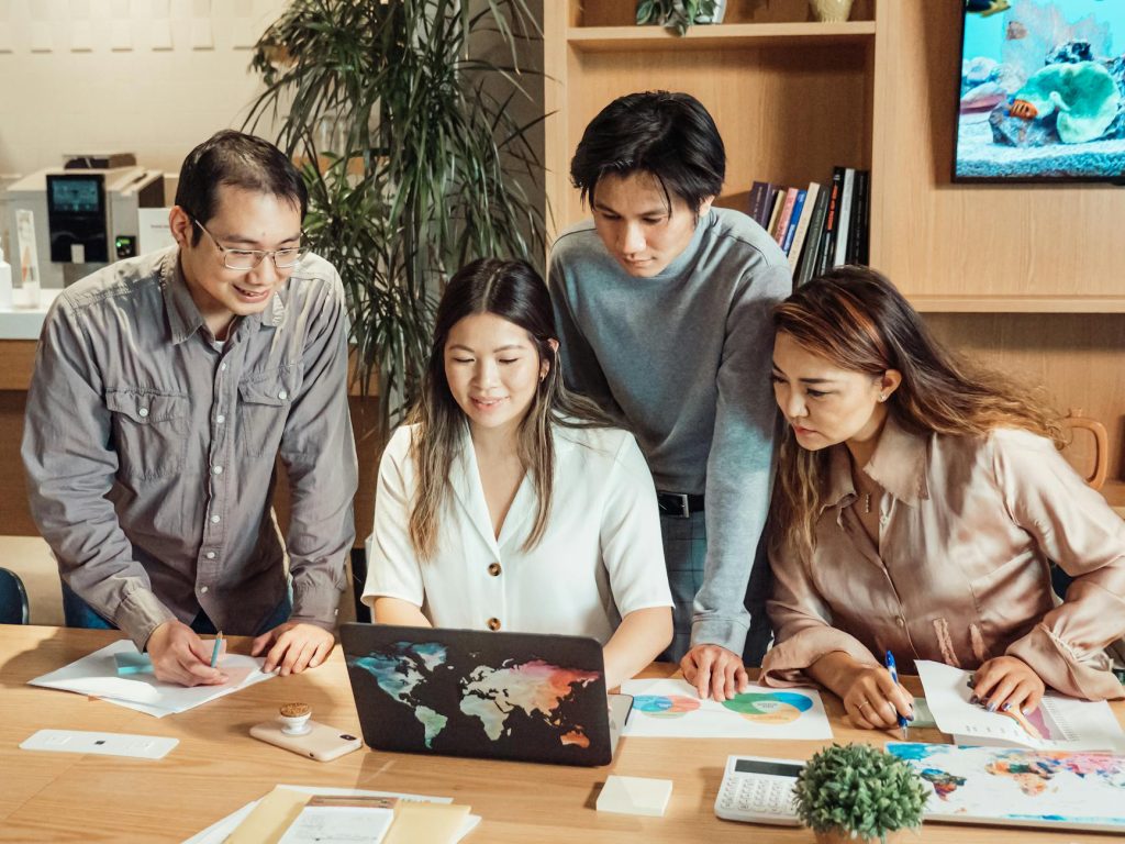 a group of people having a meeting in the office